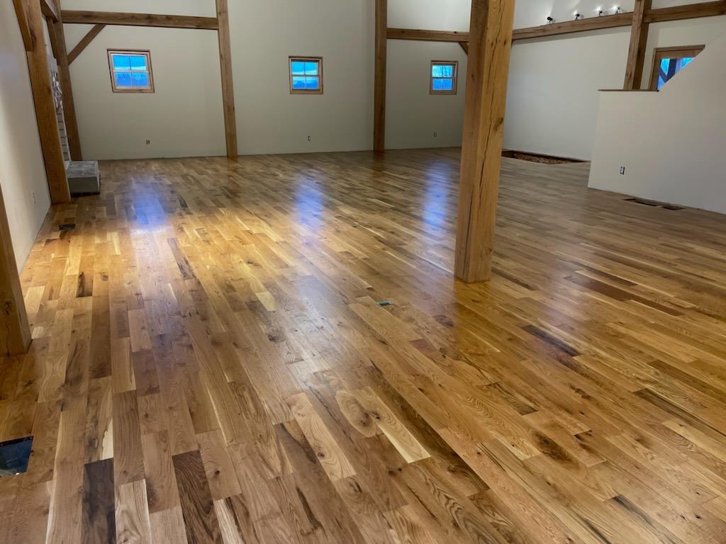 Empty room with shiny wood flooring