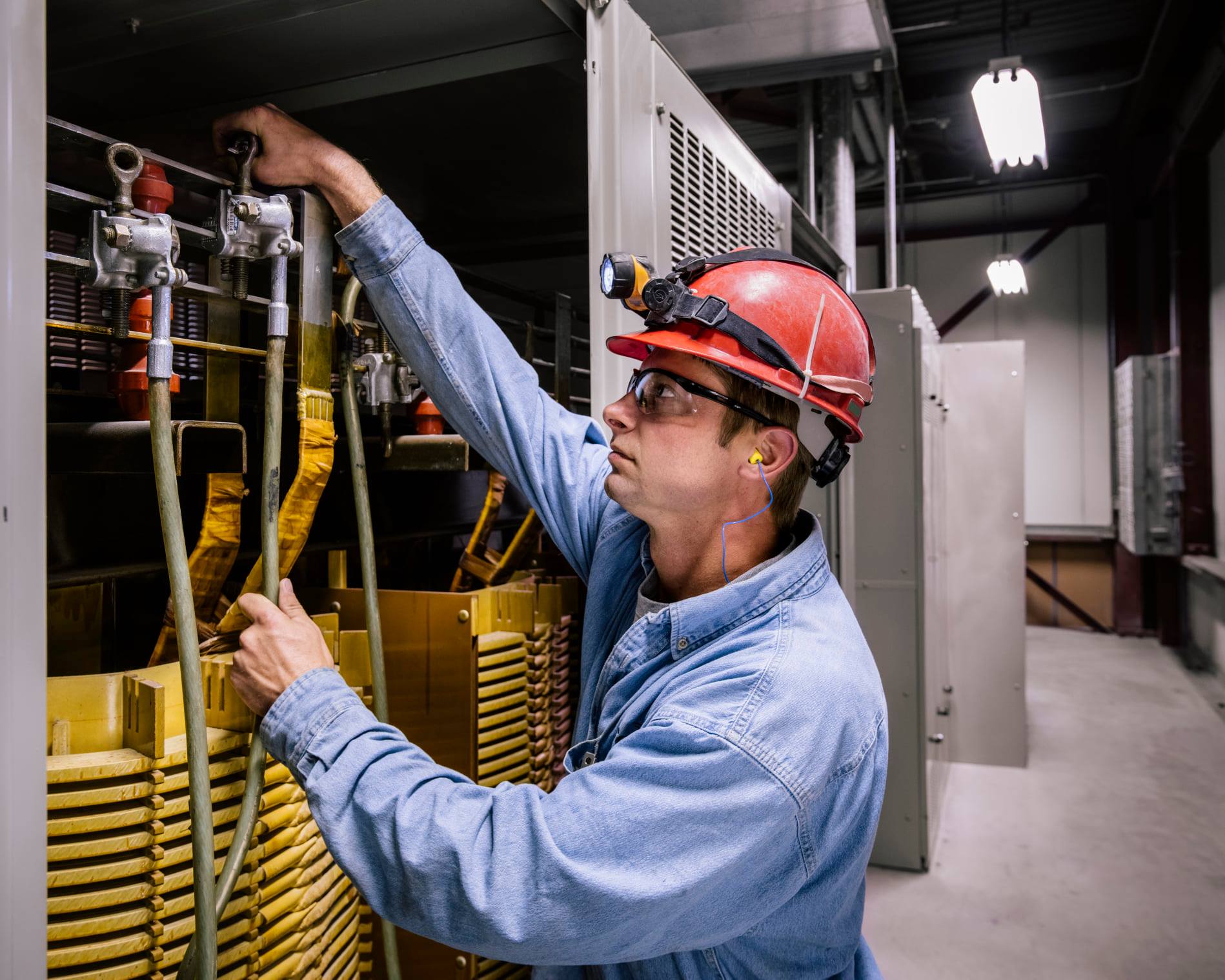 Man working on pipes in personal protective equipment