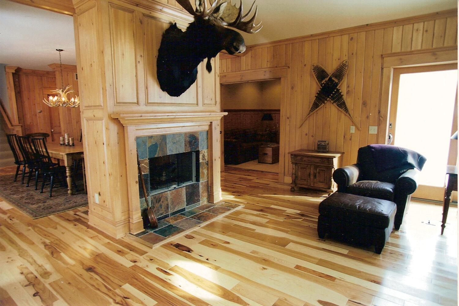 Whitewater Hickory cabin style room with wood walls and flooring