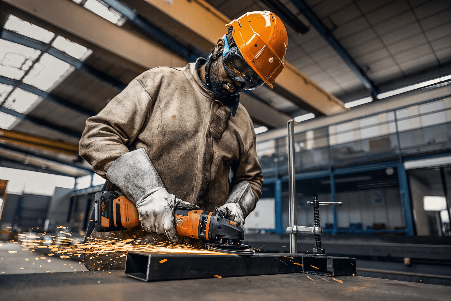 Fein angle grinder grinding metal in a workshop