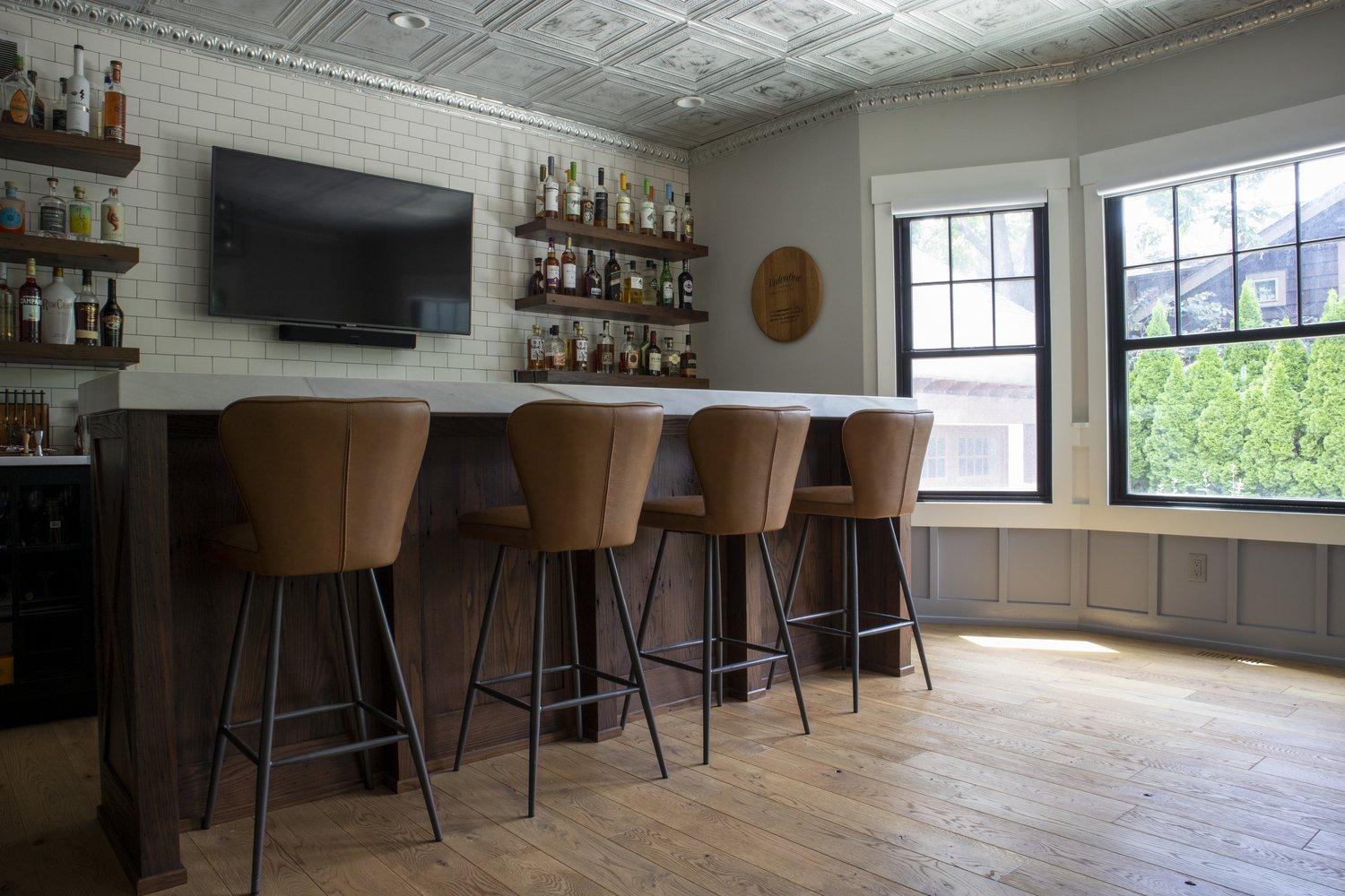 home bar with wood floors