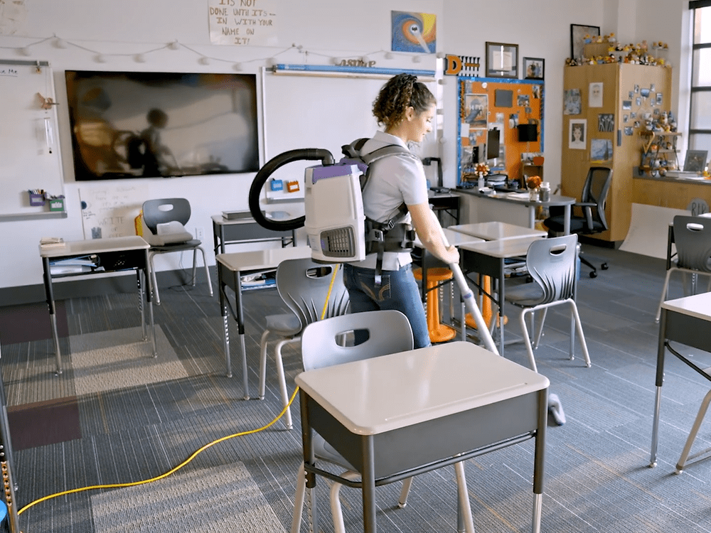 Classroom being cleaneed with a pro team vacuum