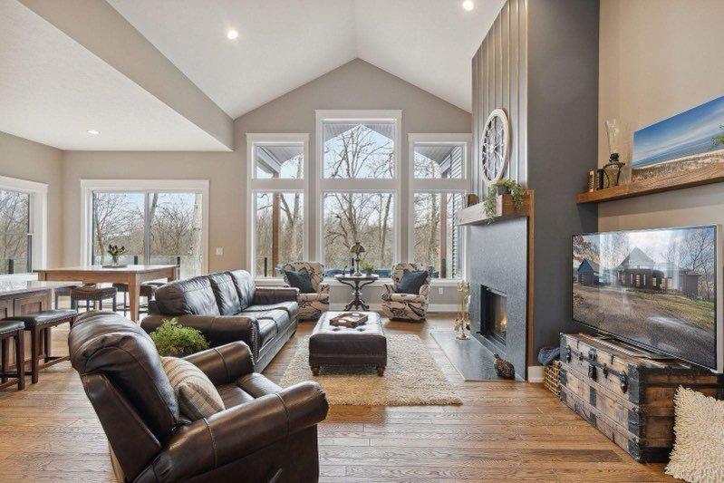 living room with wood flooring and tall ceilings