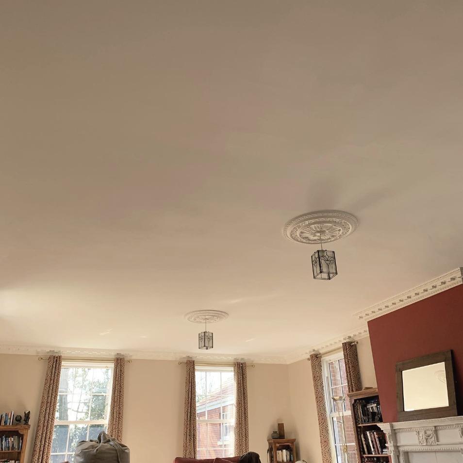 Room ceiling with decorative light designs