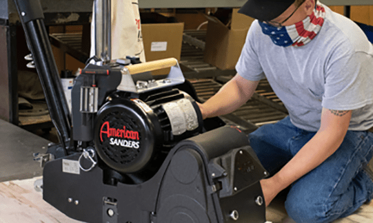 American Sanders tool being used by a man with an american flag mask